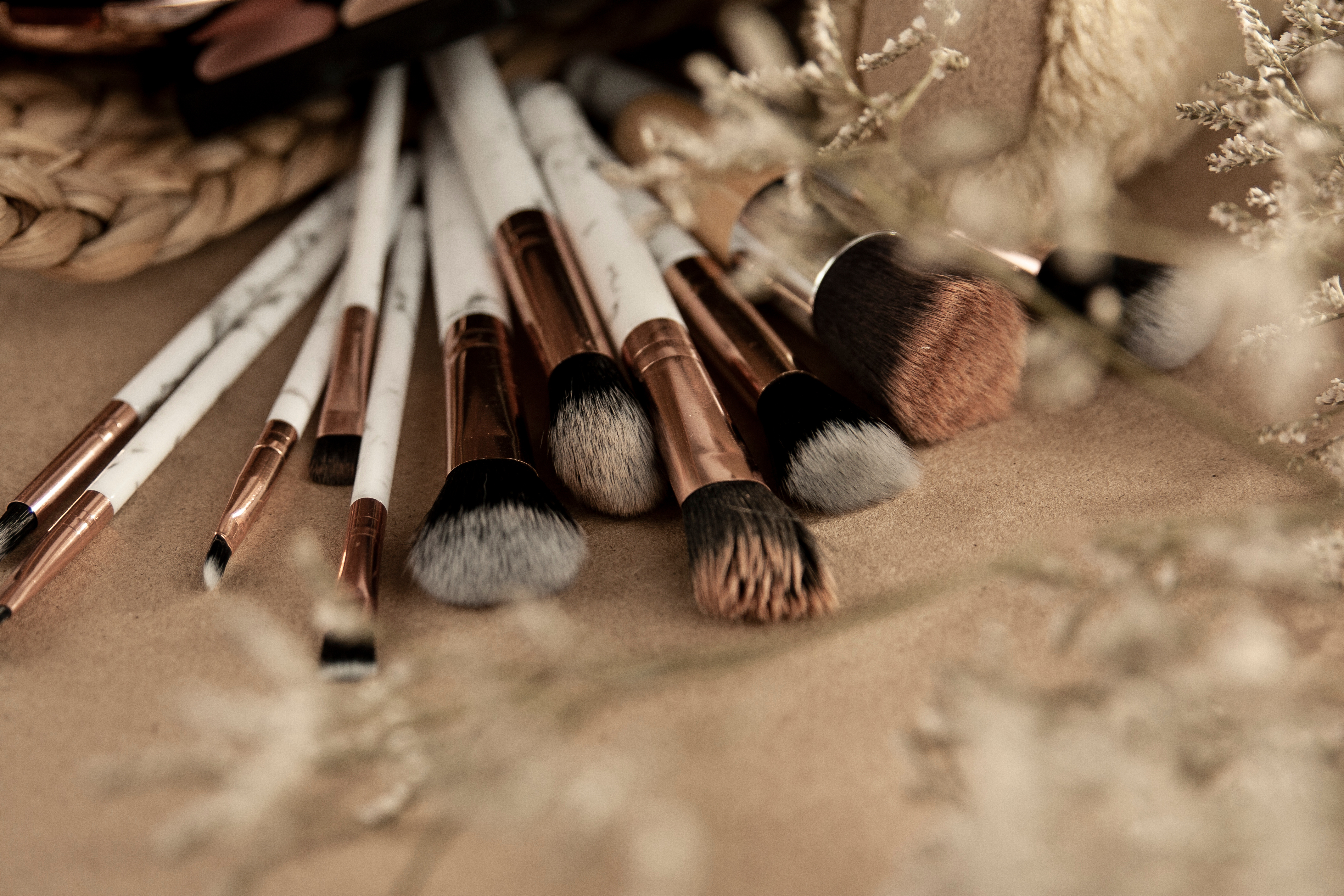 Makeup brushes spread out on table